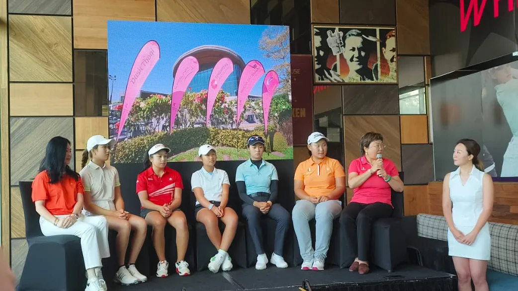 Live interveiw at the Nest cafe, Laguna Golf Singapore. Featuring LED screen as the backdrop. A group of women golfer are sitting down in front of the LED wall, on the stage.